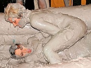 Lesbian babes getting freaky and dirty while mud wrestling