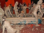 Hot and sexy lesbian babes doing battle in a muddy pool