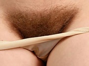 Real hairy amateur tease Mahonia spreading her furry pussy