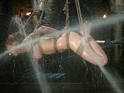 Scarlett Pain sexy redhead is tied up and sprayed with water