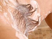 Hairy curvy natural amateur Kandie spreading in the shower