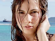 Busty beach babe Connie playing naked outdoors in ocean