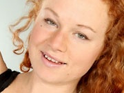 Curvy hairy redhead Mona strip teasing and spreading her unshaved muff