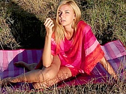 Charming nude blonde teen with nice slim figure revealing pussy on the nature in this video.