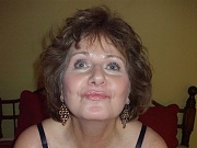 Busty Mommy with 38DDs Poses in Black Rubber Stockings