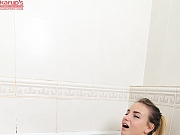 Busty Angelica Rosenburg masturbates in shower with dildo and water. 