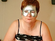 Masked mature slut playing with herself