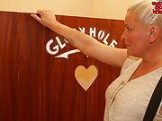 Granny fucking and sucking behind the gloryhole