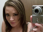 Carmen plays with her tits and pussy while taking some hot self pics.
