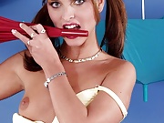 Slim teen in pigtails in white brassiere gets kinky with an umbrella 