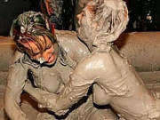 Topless muddy brunette wrestling babe winning the match