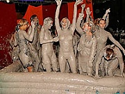 Large group of hot babes wrestling and getting extra muddy
