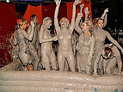 Large group of hot babes wrestling and getting extra muddy 