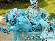 Nicely dressed hotty babes having a very messy pie fight