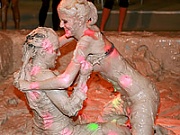 Daring lesbian teenage hotties wrestling in a tub of mud