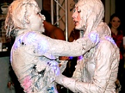 Two very hot and messy babes get completely covered in mud
