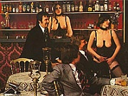 Three hairy topless seventies bartenders serving drinks