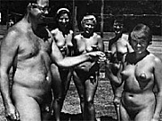 Vintage nudist going fully naked on the natural camping