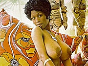 Black seventies hottie showing her massive natural boobs