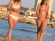 Girls in wet bikinis recorded in various poses
