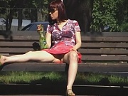 Hidden upskirt video of amateur girl relaxing on the bench