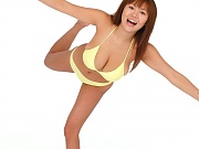 Av idol Yoko Matsugane posing in yellow bikini