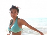 Erina Yamaguchi posing in several bikinis the shape of her beautiful big breasts.