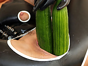 I shove two cucumbers into my stretched wet latex cunt.