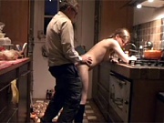 Senior shagging a beauty doggystyle in the kitchen hard