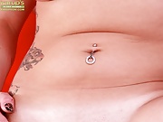 Tattooed MILF Brandy Lee fingering pierced pussy. 