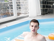 Russian twink Vitali Kutcher floats in the pool with a hard cock.