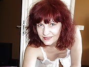 Older mature redhead Wanda stuffs pussy with big toy. 