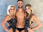 Co-Ed swimmers and athletes hanging out in their lycra swimwear.
