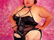 Dominatrix BBW in Black Suit Posing with Whip